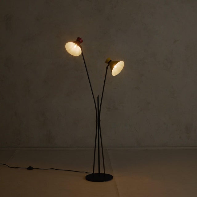 Attributed to Stilux, this Italian floor lamp from the 1950s illustrates where structure is reduced to line and color is...