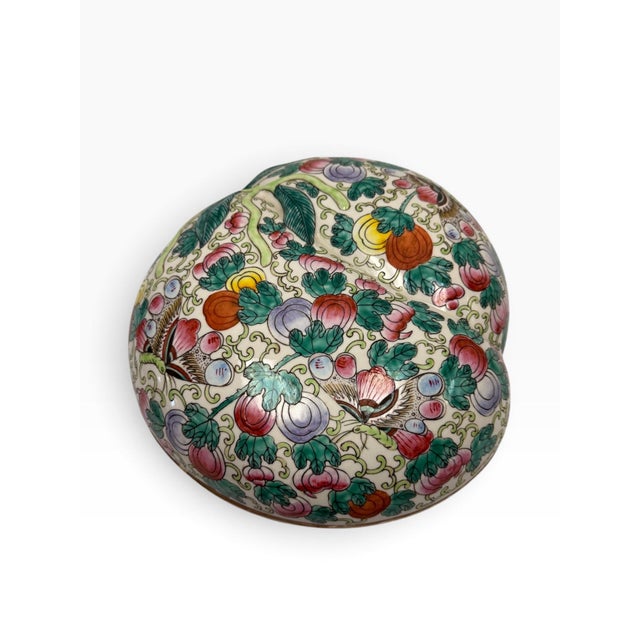 A beautifully crafted and exceptionally vibrant vintage Chinese porcelain lidded trinket or presentation box, modeled in a...