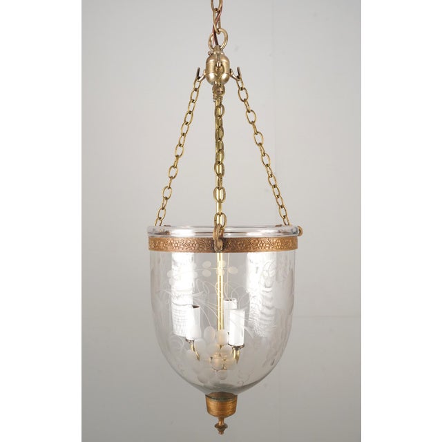 Antique original hand blown clear crystal bell jar pendant light with brass hardware. This light requires three E-12...