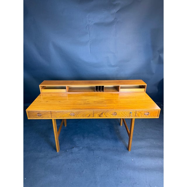 Available for purchase is a vintage Danish Modern Flip-Top Teak Desk by Peter Løvig Nielsen, in all-original condition....