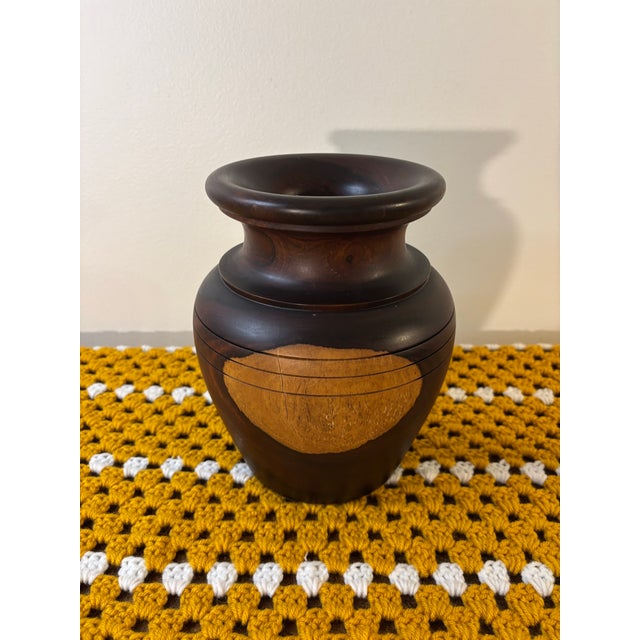 A beautifully hand turned mid century studio wood vase, sculpted from a single block of solid hardwood, likely walnut. The...
