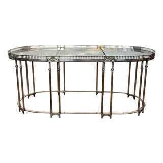 Neoclassical style coffee table in silver metal with antique mirror top For Sale