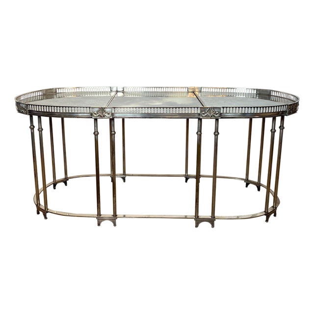 Neoclassical style coffee table in silver metal with antique mirror top For Sale