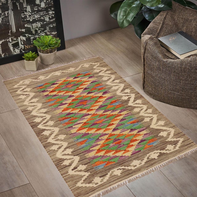 Elevate the elegance of your home with this stunning hand-woven tribal Kilim wool rug. Meticulously crafted on a loom by...