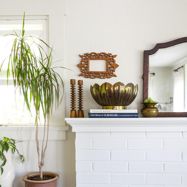 This sculptural, lotus-shaped planter or bowl is made from sheet brass shaped into a lotus flower balanced on a round...