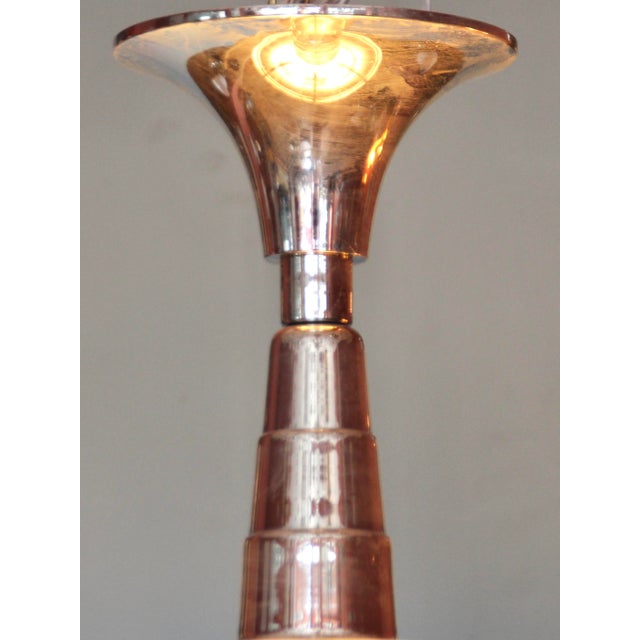 This round Art Deco chandelier in nickel-plated brass resembles models from the Petitot company. The five vertical,...