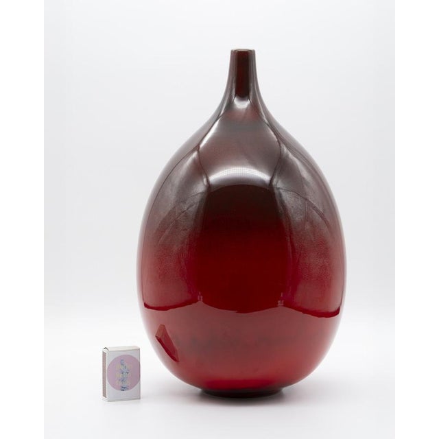 Tall mid-century ceramic vase from Ernestine Cannon’s Salerno workshop with a softly swelling body, slim neck and a dense,...