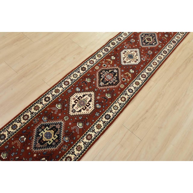 An authentic vintage traditional Kashmar runner hand-knotted with fine wool and natural dyes. This intricately woven rug...