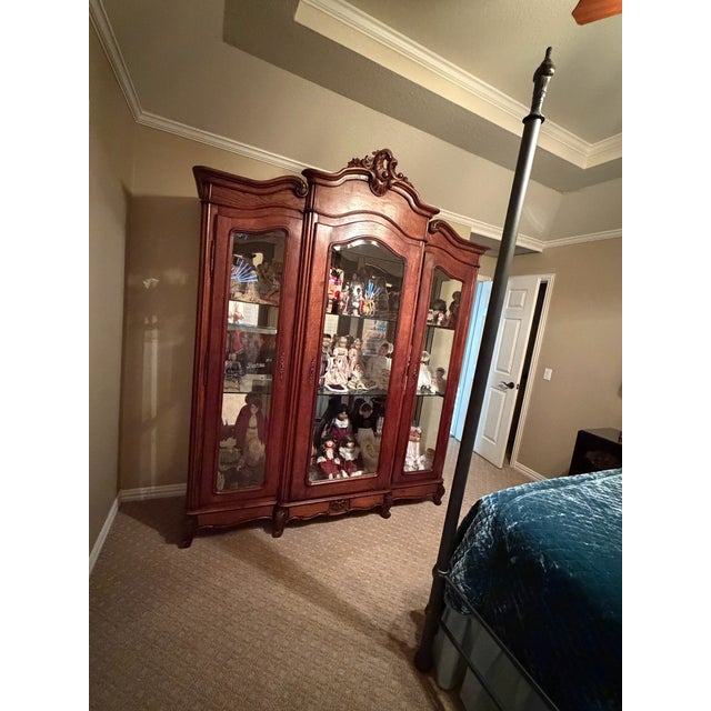 French Louis XV Three-Door Display Antique Cabinet 1900-1910 Era 79"L x 24"W × 96"H Beveled glass on all three doors and...