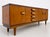Rare extra long Mid Century Modern teak + rosewood credenza by Bath Cabinet Makers, England, c. 1960’s. This substantial...