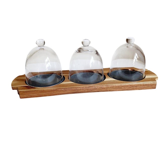 Elevate your entertaining experience with our exquisite Charcuterie Board featuring three elegant glass domes atop a...