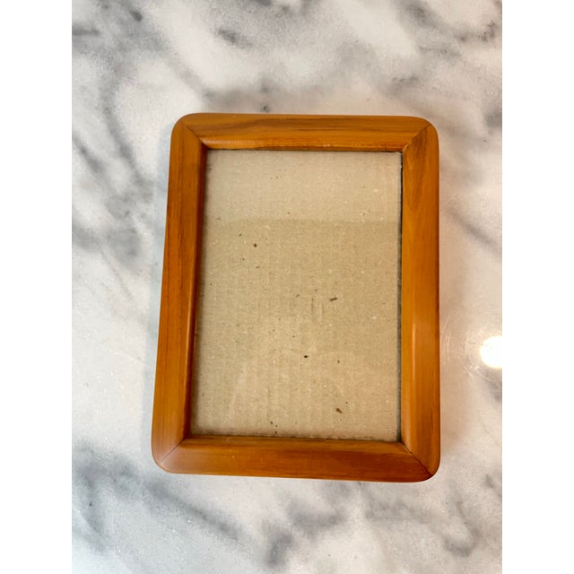 A vintage Danish modern style teak picture frame with rich, warm teak wood with soft edges. This frame can be displayed...