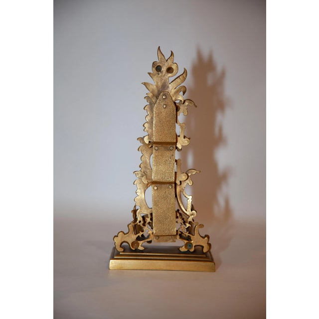 French. Mid 19th century. Gilt with leaf, scroll and column decoration. Oblong molded base and weighted base. Four (4)...