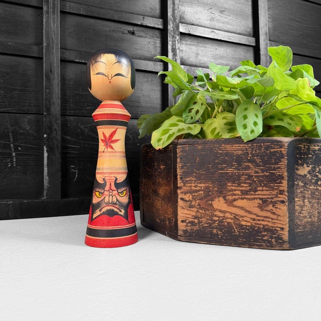 Distinctive Japanese wooden kokeshi dating from around 1980, crafted by Moriharu Kitayama, an artisan of the Tsugaru...