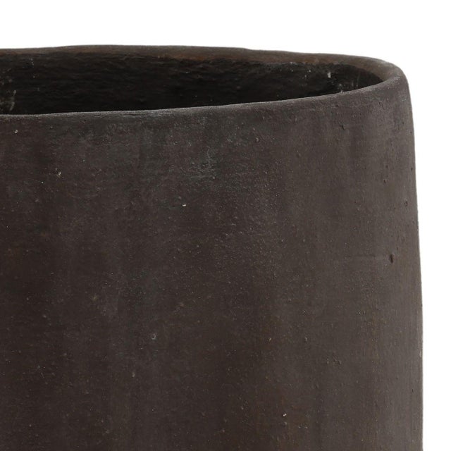 Crafted from reinforced composite concrete material and perfect for outdoor use, this planter brings an organic,...