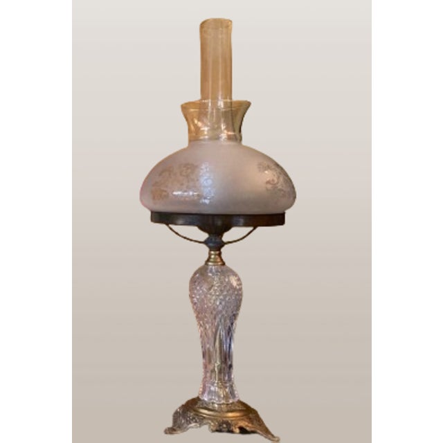 Wonderful lamp originally used as a candle holder with Art Nouveau design in relief bronze and cut glass centerpiece. This...