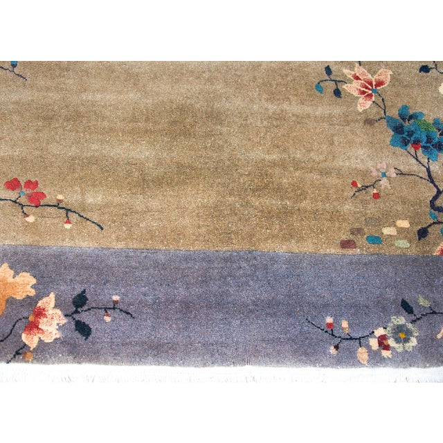A wonderful early 20th century Chinese Art Deco rug with a chic gray field surround by another gray border, and all...