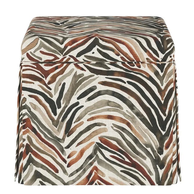 The sleek, fully upholstered design of this ottoman provides a perfect accent piece for any living room environment....