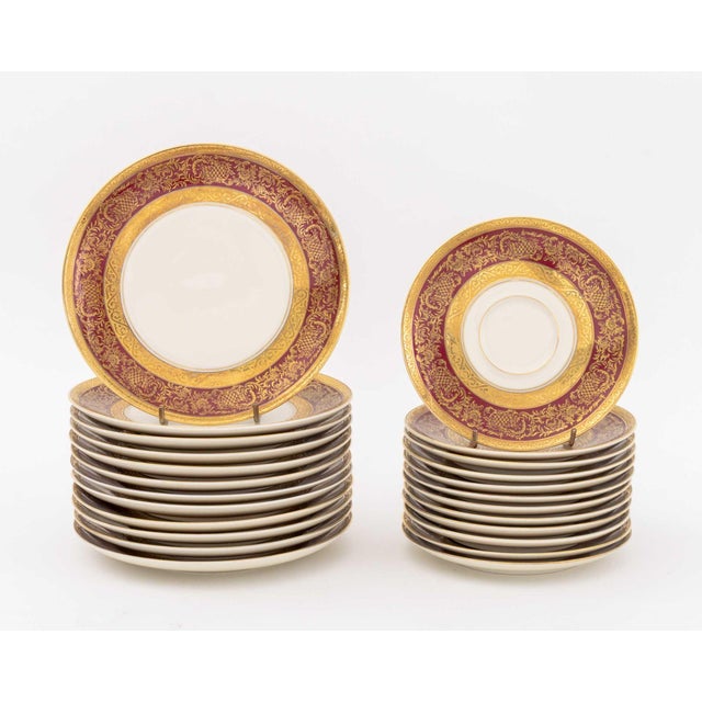 Rosenthal Porcelain Partial Dessert Service Set, with gilt floral and burgundy trim, comprising: ten teacups, 12 saucers,...