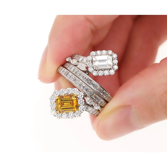 A two-piece detachable engagement ring in 18k solid gold. Each band contains a GIA-certified center stone and can be...