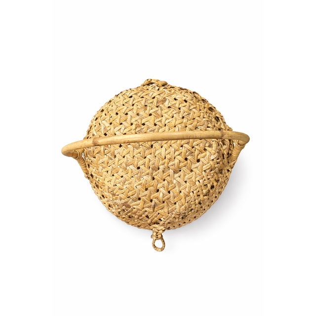 Beautiful vintage handwoven storage basket dating to the mid-20th century, featuring a sculptural domed lid and...