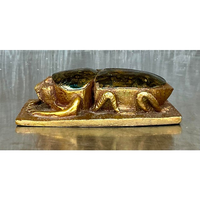 Embrace ancient mystique with this captivating Vintage Boho Gilt Tipped Scarab, a decorative object brimming with symbolic...