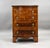 A fine Georgian-style walnut Serpentine bachelor’s chest, of compact proportions, raised on shaped bracket feet. The...