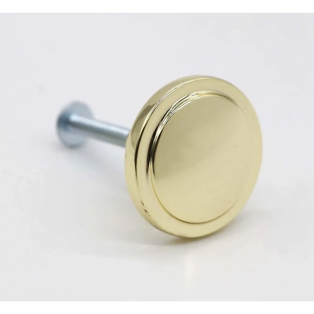 Petite polished brass round cabinet or drawer pulls. Screws included. Made by Amerock. Stamped 3443-1 on the back. They...