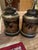 Beautiful matched pair of Chinoiserie tea caddy table lamps featuring rich black bodies with intricate gilt and multicolor...