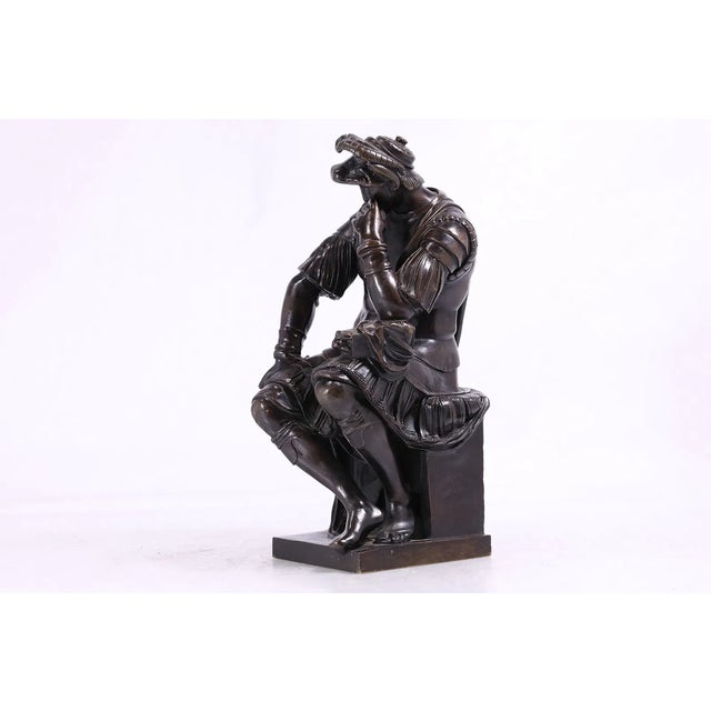 A finely cast 19th-century bronze sculpture after Michelangelo’s celebrated figure of Lorenzo de’ Medici, Duke of Urbino,...