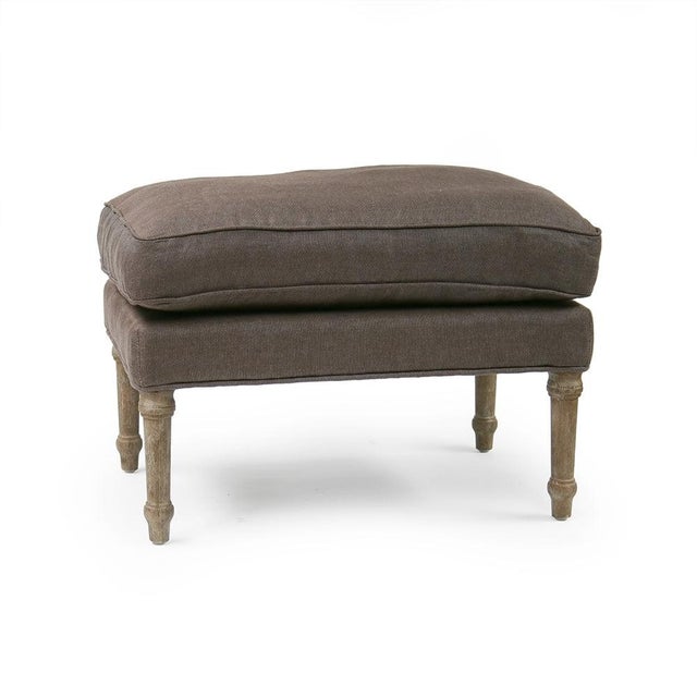 The Louis Ottoman from Zentique is a French Louis XVI-style ottoman in limed grey oak with aubergine linen upholstery. The...