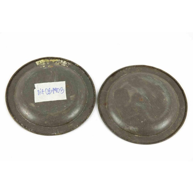 Pair of painted Tin Coasters is an original decorative object realized in the 1950s. Made in Italy. Dimensions: Ø 11 cm....