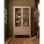 Interlaced oval fretwork spans the glazed doors from top to bottom, turning their clear panels into a decorative feature....