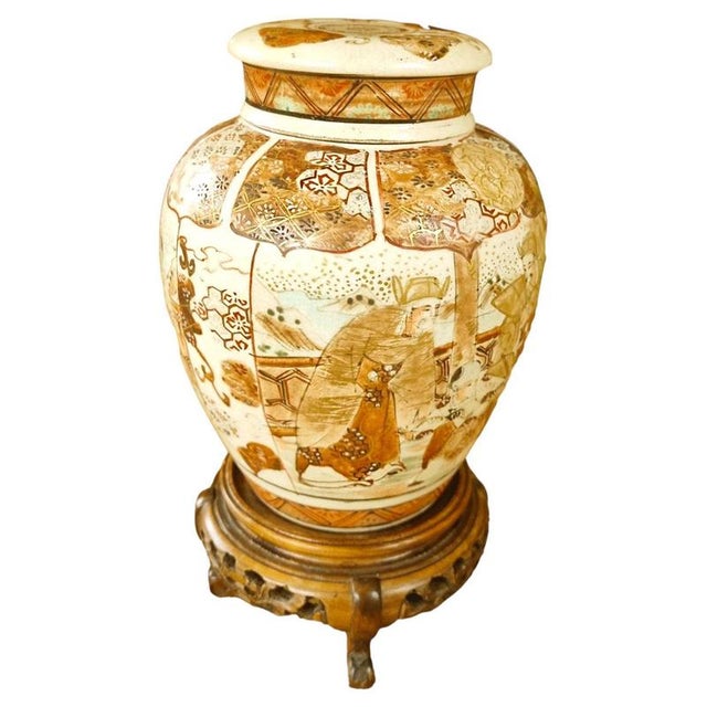 A decorative Japanese Satsuma lidded vase dating to the Meiji period. The vase is accompanied by its matching stand,...