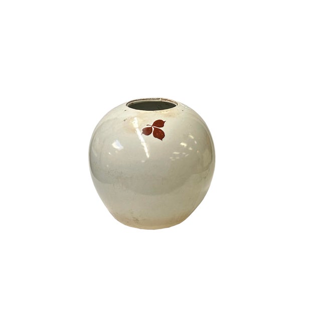 This small, spherical ceramic vase exudes a delicate charm with its minimalist yet elegant design. Crafted from smooth,...