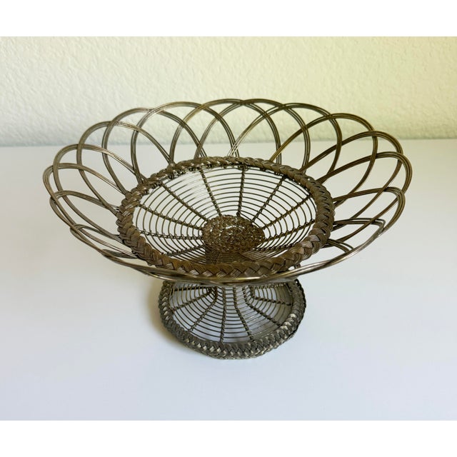 A wonderful antique French wirework fil de fer pedestal basket. Historically, these handcrafted wire pieces were popular...