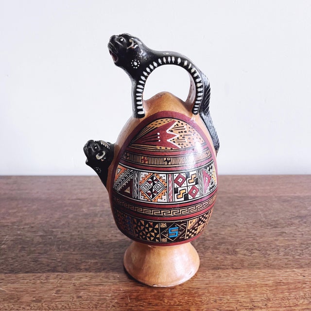 A classic piece of Peruvian artisanal clay vessel with jaguar motifs. Marked Cusco, Peru on the base — adds a beautiful...