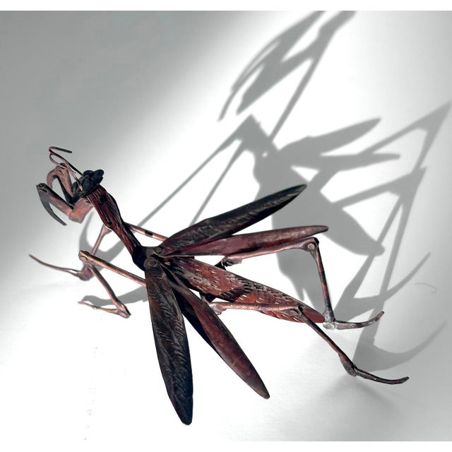 A rare articulate praying mantis made by Myochin Hiroyoshi in the late Meiji Period circa 1890-1900s. As an ornamental...