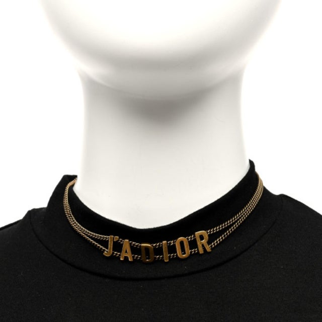 Elevate your accessory game with this Necklace in aged gold metal, a stunning choker from the renowned brand Christian...