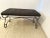 Stylish mid century modern bench having curlicue steel base with decorative brass ball accents and upholstered in a...