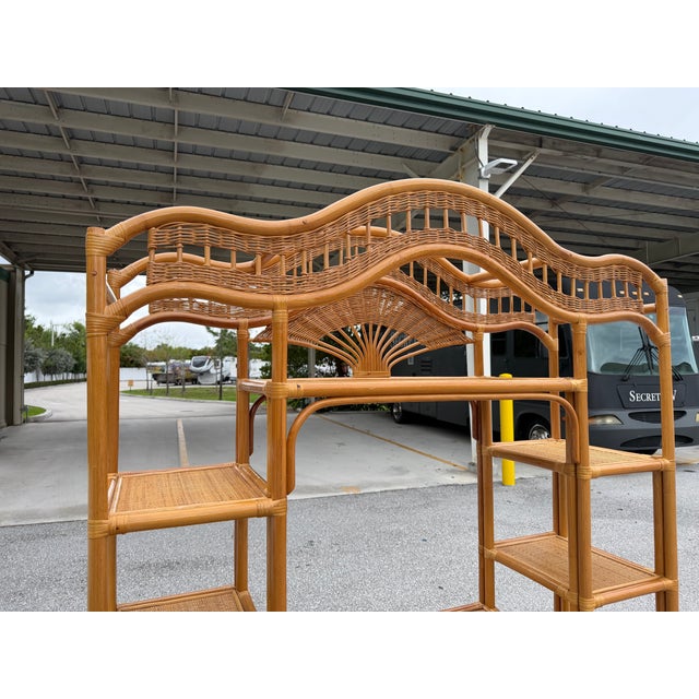 Enhance your space with this amazing vintage bohemian Etagere. The arched top design, bamboo and rattan build, and wicker...