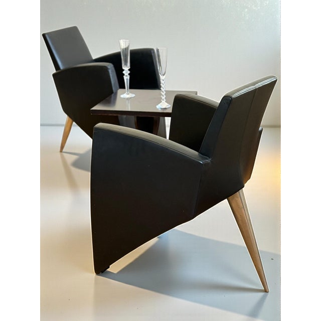 This rare pair of "J." armchairs represents a definitive icon of 1980s Postmodernism. Designed by Philippe Starck in 1984...