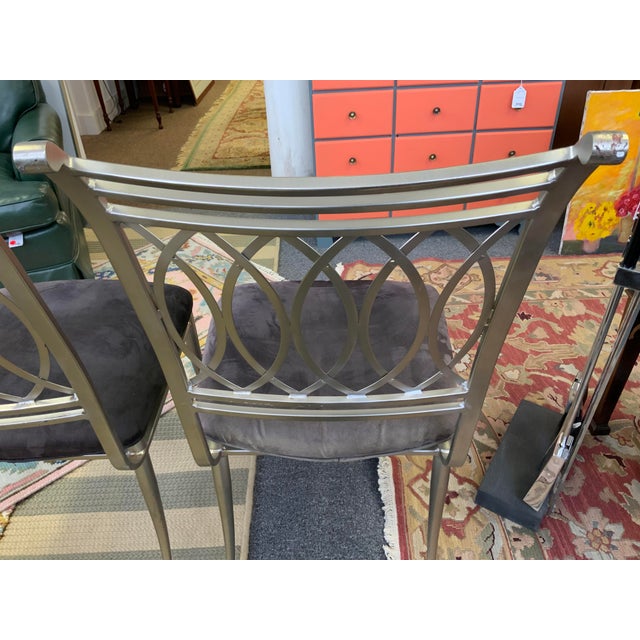 Pair of late 20th century metal dining chairs. Sabre legs, oval lattices back design, microfiber seats(faded fabric). No...