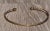 The Belmar Vintage Minimalist Bangle bracelet in Yellow Gold. The bracelet features a larger pointed end which contains a...