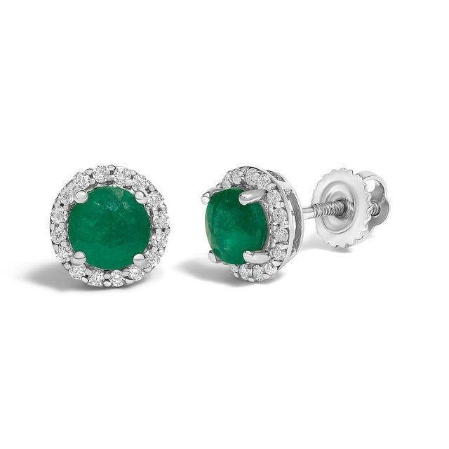Immerse yourself in the allure of these exquisite 10K white gold stud earrings, each centered with a captivating 5mm...