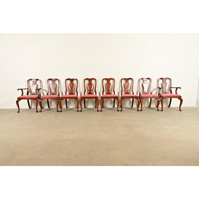 An outstanding set of eight Queen Anne or Georgian style dining chairs By Henkel Harris USA, Circa 1970s Solid cherry wood...