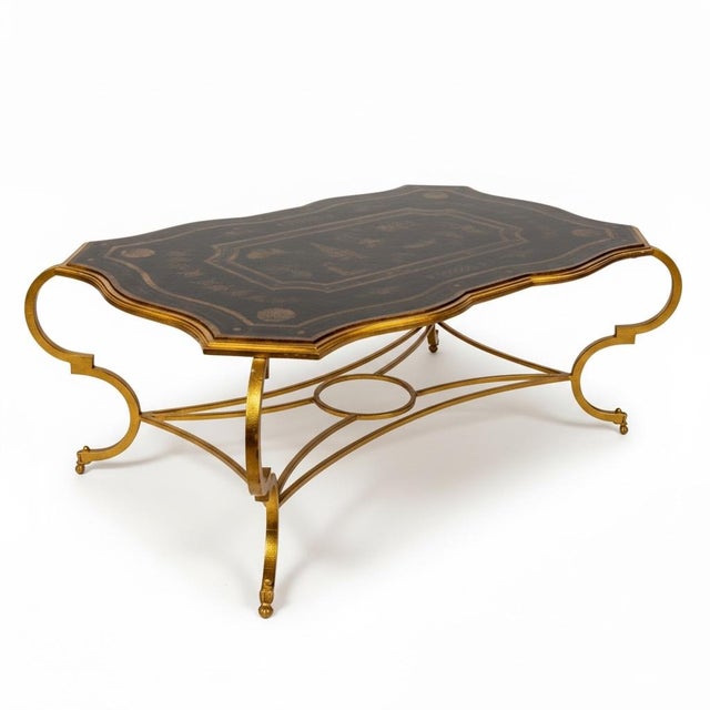 This is a large scale chinoiserie tray form coffee table. It is attributed to Maitland-Smith. The base is a heave gilt...