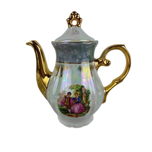 A set of 15 pieces coffee service, from the 1950s, including six cups and saucers, tea pot, sugar and creamer. These are...