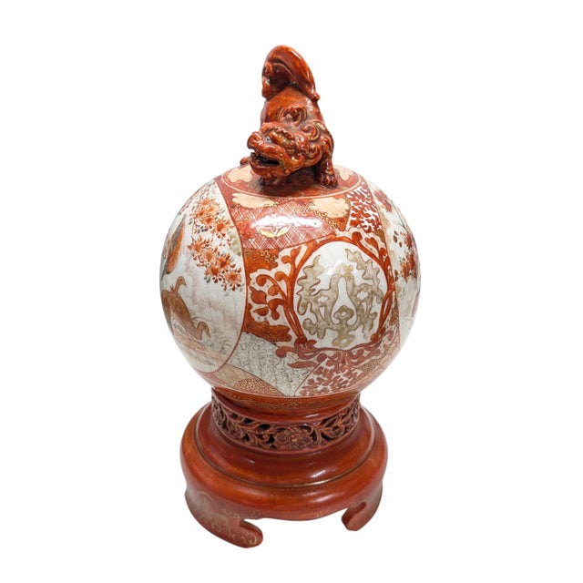 A JAPANESE KUTANI PORCELAIN KORO AND GLOBULAR COVER, the lid painted with a main panel to each side; one with figures in...