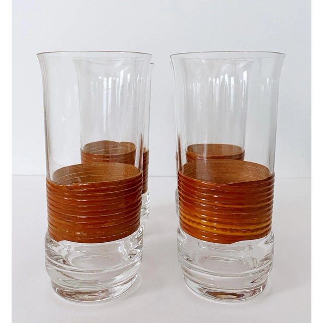 Very cool set of 4 vintage Mid-Century Modern rattan wrapped high ball glasses. Beautiful, delicate glass, with lovely...